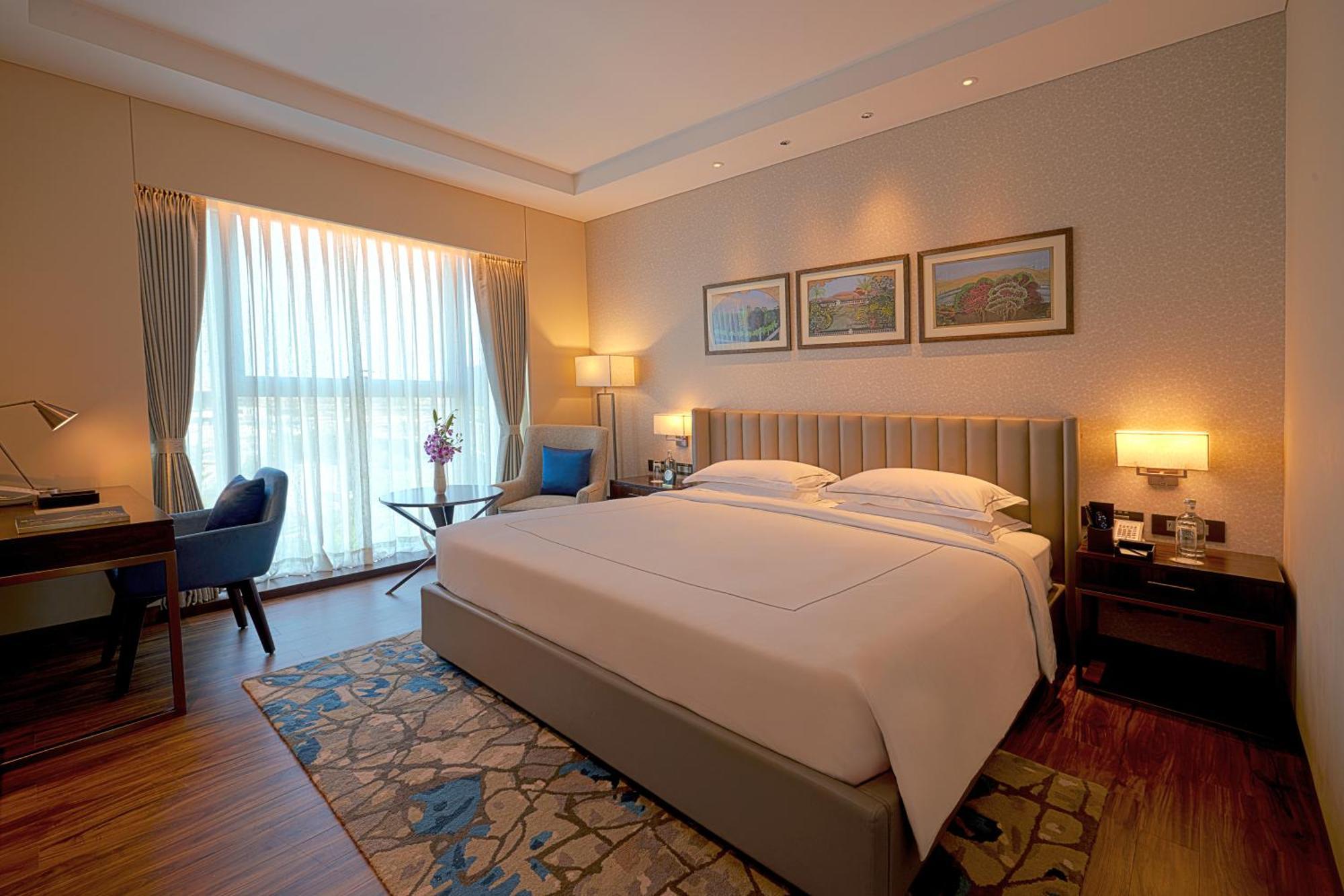 Taj Bangalore Devanahalli Dış mekan fotoğraf A bedroom at the Taj Bengal